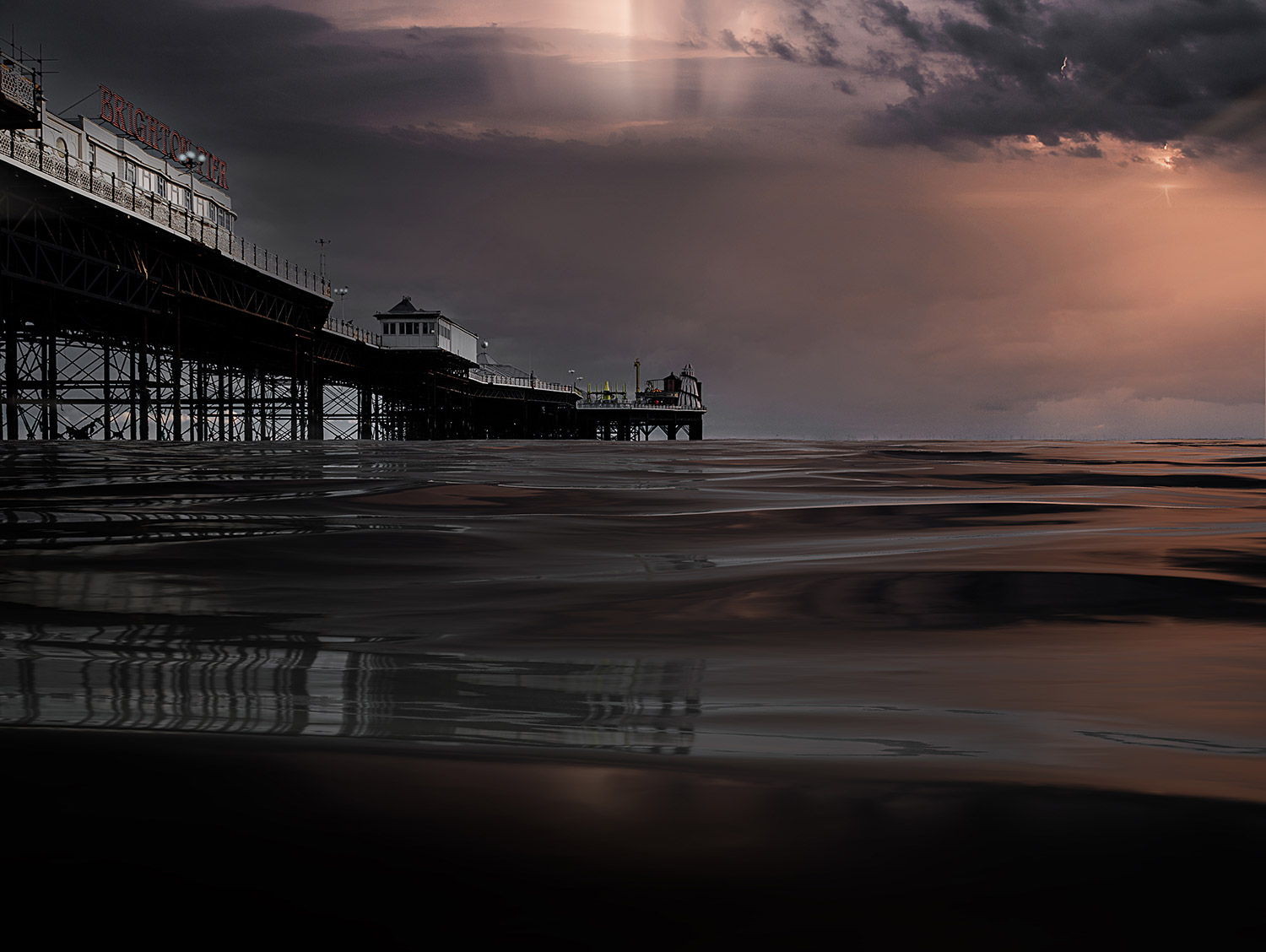 Palace Pier sunburst behind the storm clouds by Brian Roe