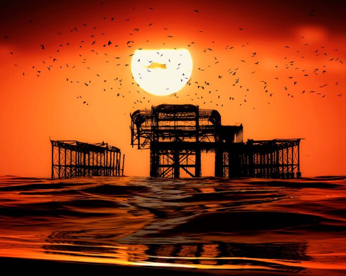 Great Ball of Sun. Sunset & Birds over the West Pier in Brighton by Brian Roe