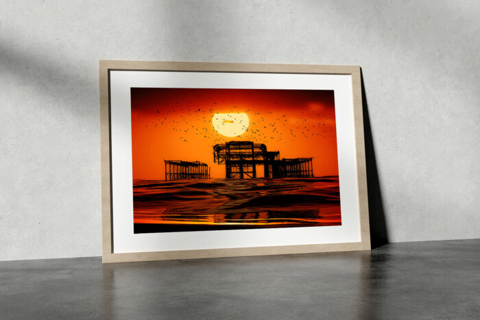 Great Ball of Sun. Sunset & Birds over the West Pier in Brighton. Photo in frame by Brian Roe