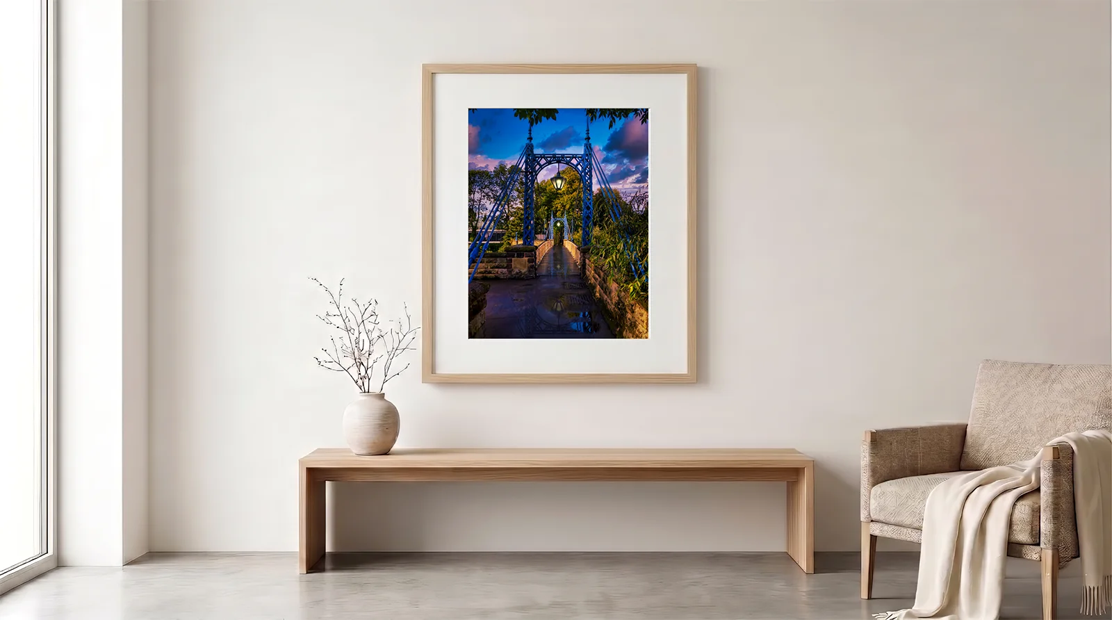 the mill bridge leamington spa framed living room Large framed limited-edition fine art photography print of The Mill Bridge in Royal Leamington Spa, displayed in a modern minimalist living room setting above a wooden bench.