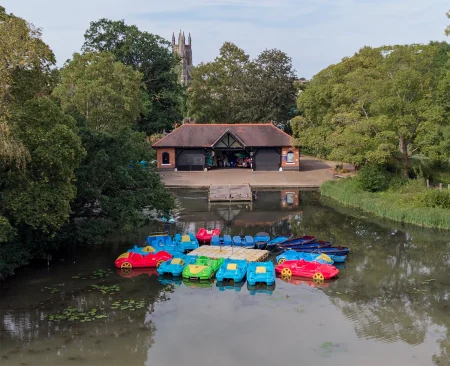 Aerial view of colourful pedalos docked at the Leam Boat Centre on the River Leam in Royal Leamington Spa.