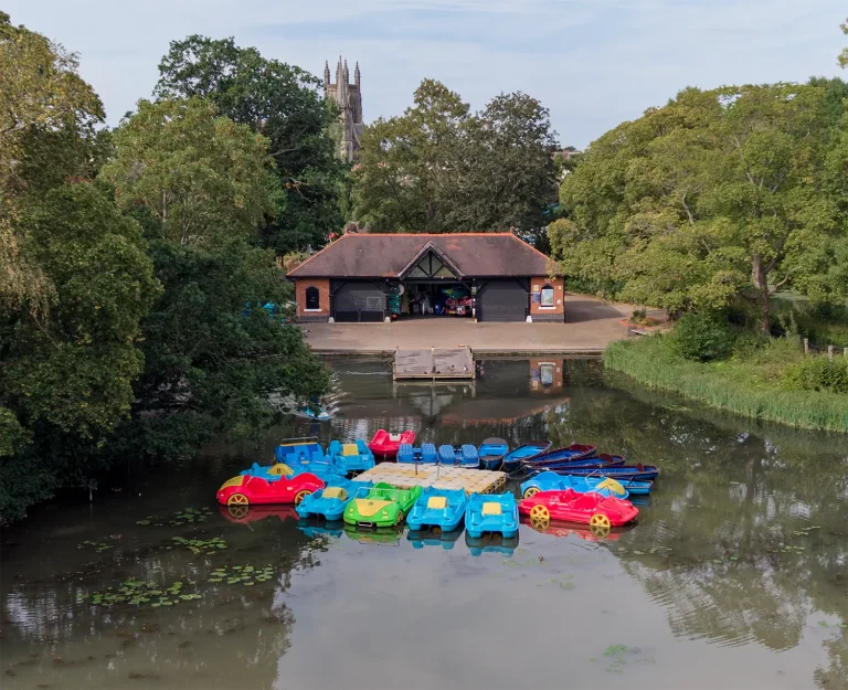 Aerial view of colourful pedalos docked at the Leam Boat Centre on the River Leam in Royal Leamington Spa.