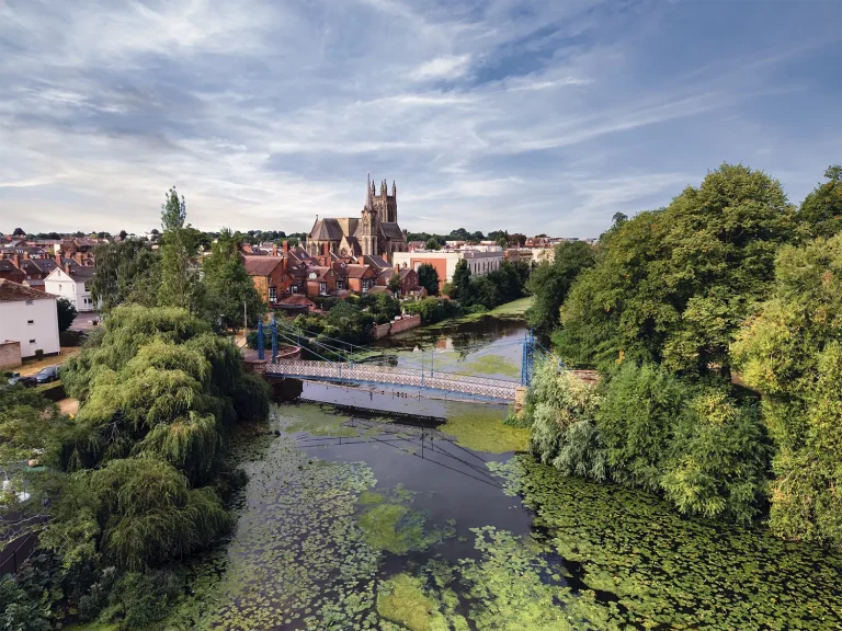 The River Leam and the Mill Bridge aerial photograph Aerial view of the blue Mill Bridge crossing the River Leam with All Saints Church and historic buildings in Royal Leamington Spa.